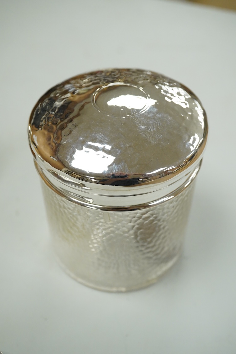 A collection of silver or white metal to include a miniature model dhal, ashtray, scent bottle and toilet jar, together with a metal Ronson table lighter.